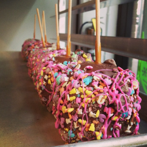 Custom Easter Caramel Apples. Caramel, Cadbury Mini Eggs, Spring Sprinkles and Pink Chocolate